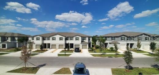 11859 Dumaine Valley Road Riverview, FL 33579 - Photo 17 of 19 a front view of a house with a yard