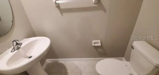 a bathroom with a sink and toilet