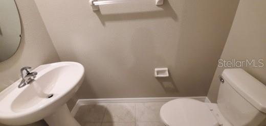 11859 Dumaine Valley Road Riverview, FL 33579 - Photo 5 of 19 a bathroom with a sink and toilet