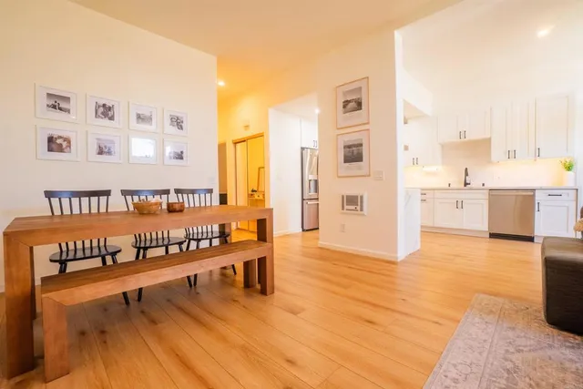 a view of a living room filled with furniture and furniture