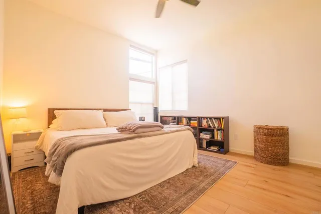 a bedroom with a bed and chair