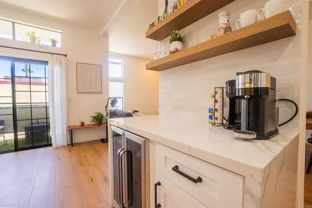 a kitchen with a sink appliances and cabinets