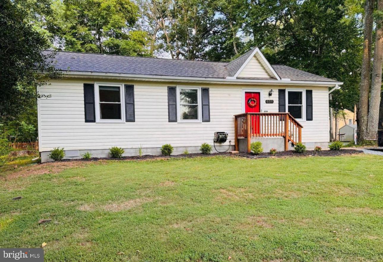 608 Tacketts Mill Road Stafford, VA 22556 - Photo 1 of 20 a front view of a house with a yard