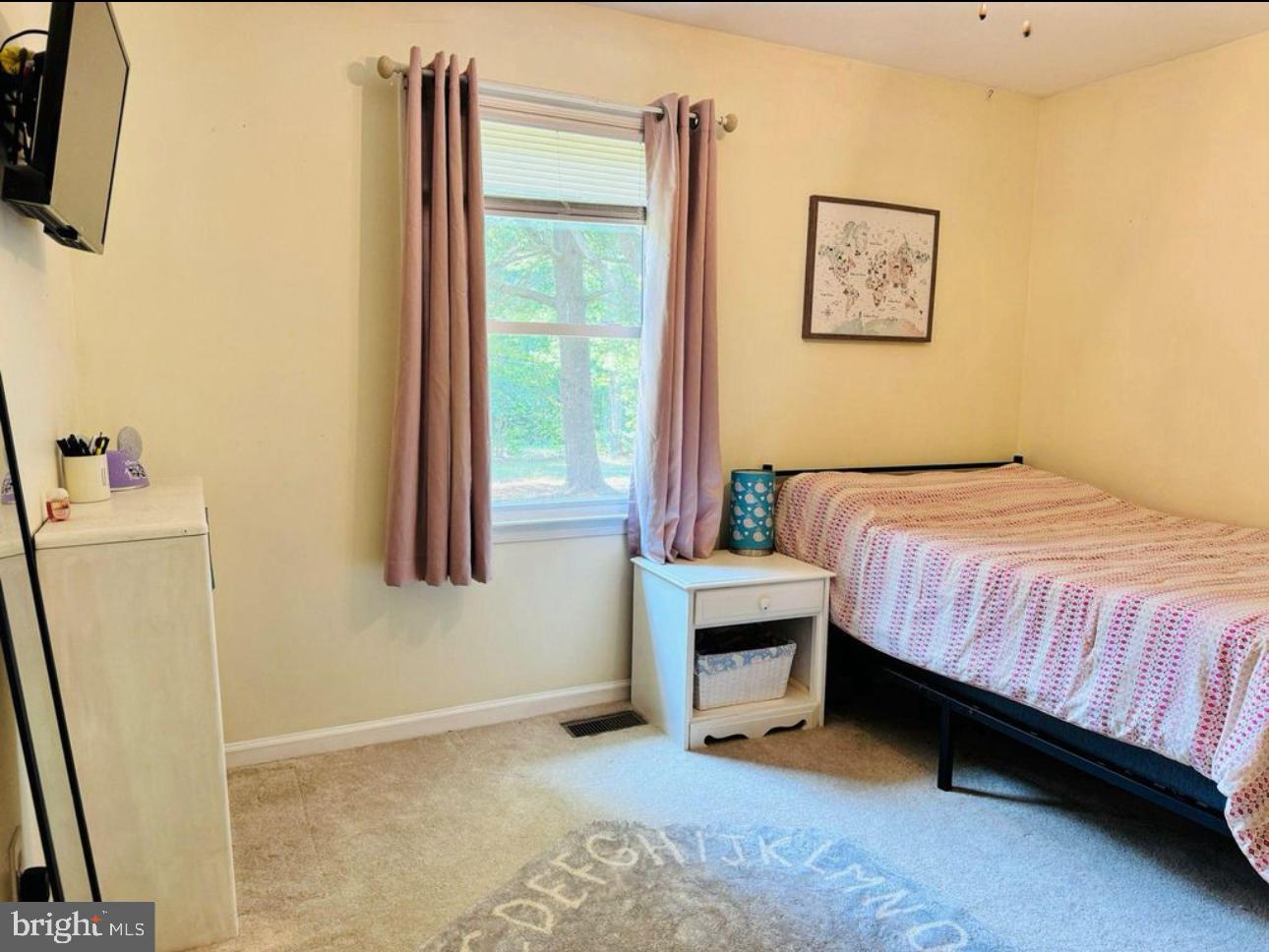 608 Tacketts Mill Road Stafford, VA 22556 - Photo 13 of 20 a bedroom with a bed and a window