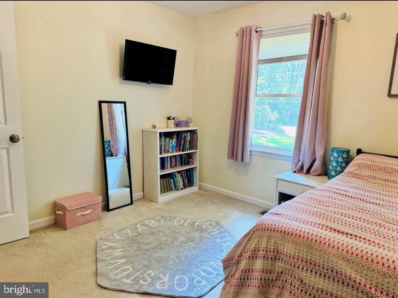 608 Tacketts Mill Road Stafford, VA 22556 - Photo 14 of 20 a bedroom with a bed and a flat screen tv