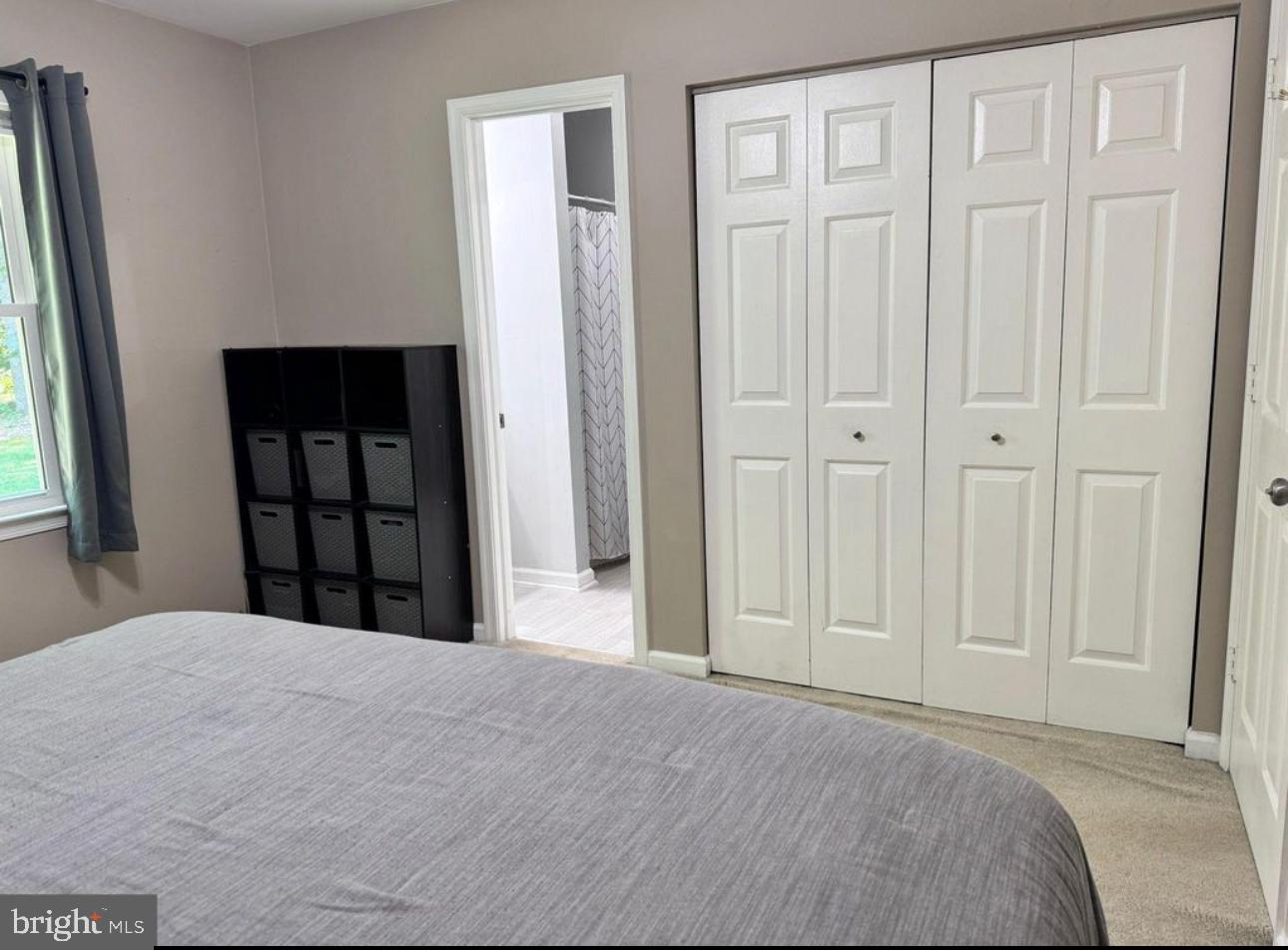 608 Tacketts Mill Road Stafford, VA 22556 - Photo 16 of 20 a bedroom with a bed and a window