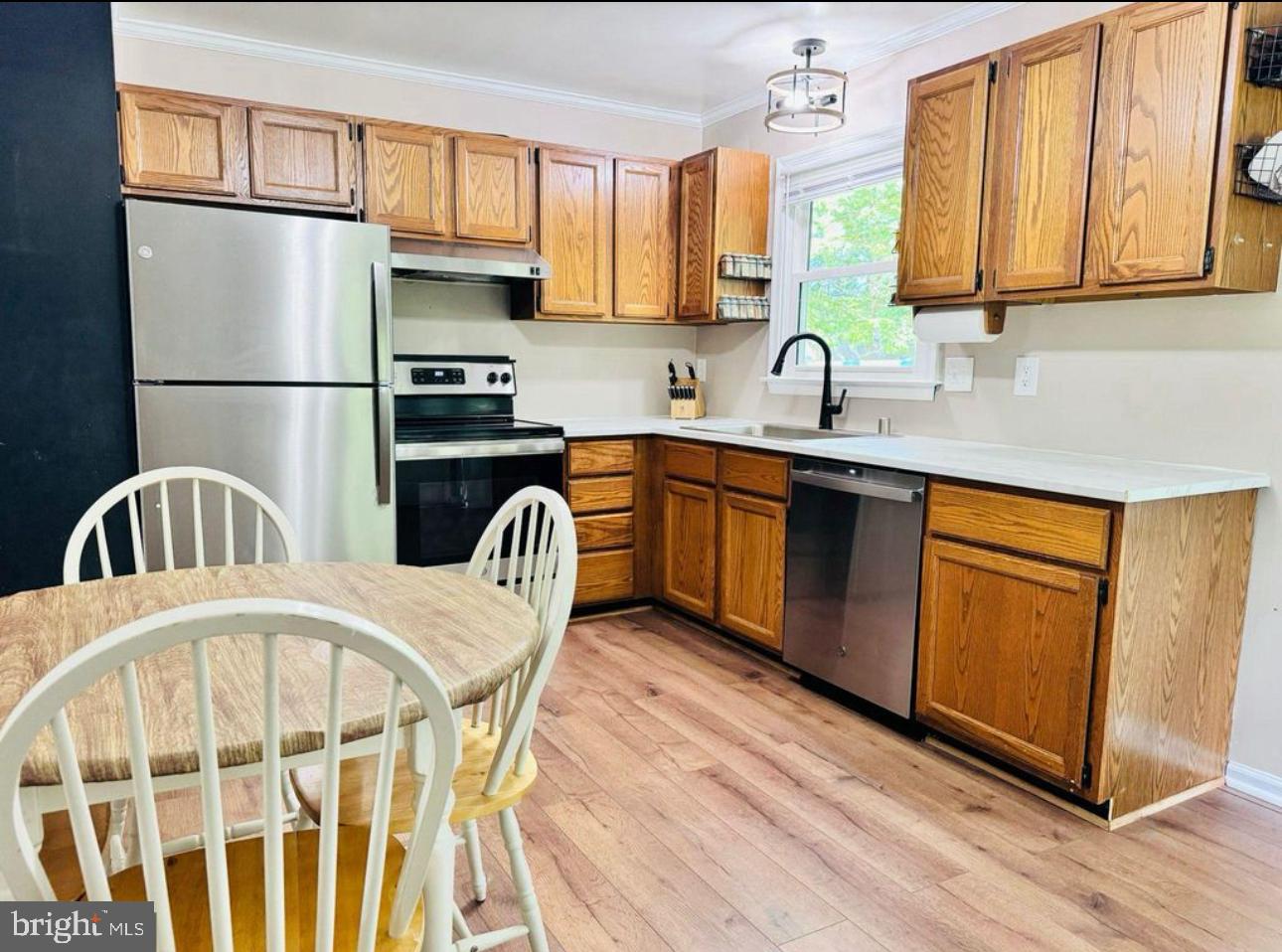 608 Tacketts Mill Road Stafford, VA 22556 - Photo 2 of 20 a kitchen with stainless steel appliances granite countertop a refrigerator a sink dishwasher a stove with wooden cabinets