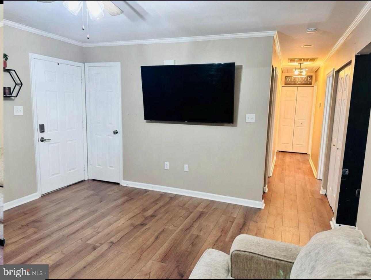 608 Tacketts Mill Road Stafford, VA 22556 - Photo 8 of 20 a living room with a flat screen tv a rug and a window