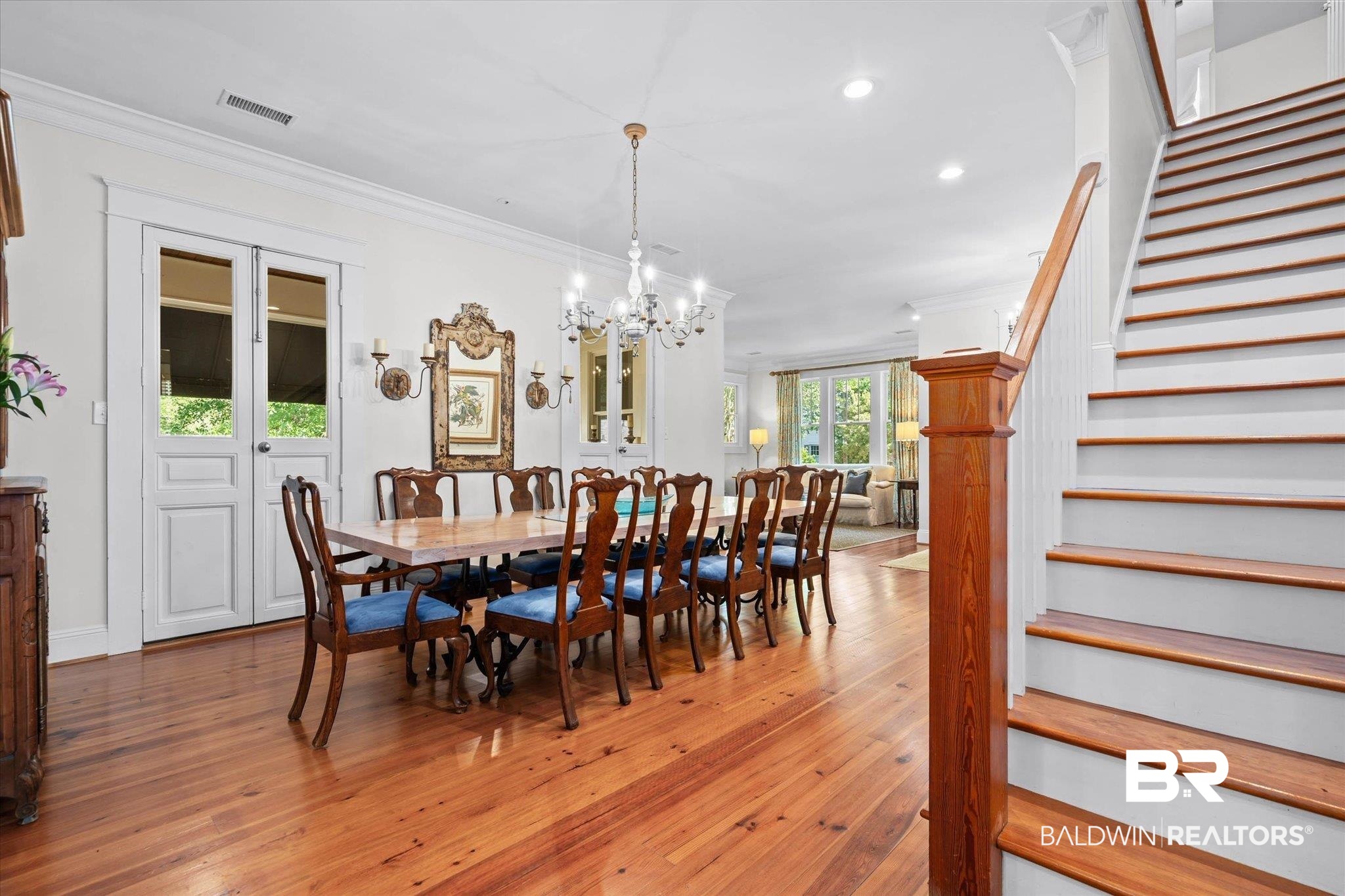3813 Austill Lane Mobile, AL 36608 - Photo 4 of 37 Spacious interior featuring wood-finish flooring, a grand staircase with wood newel post and handrail, recessed lighting, and a chandelier