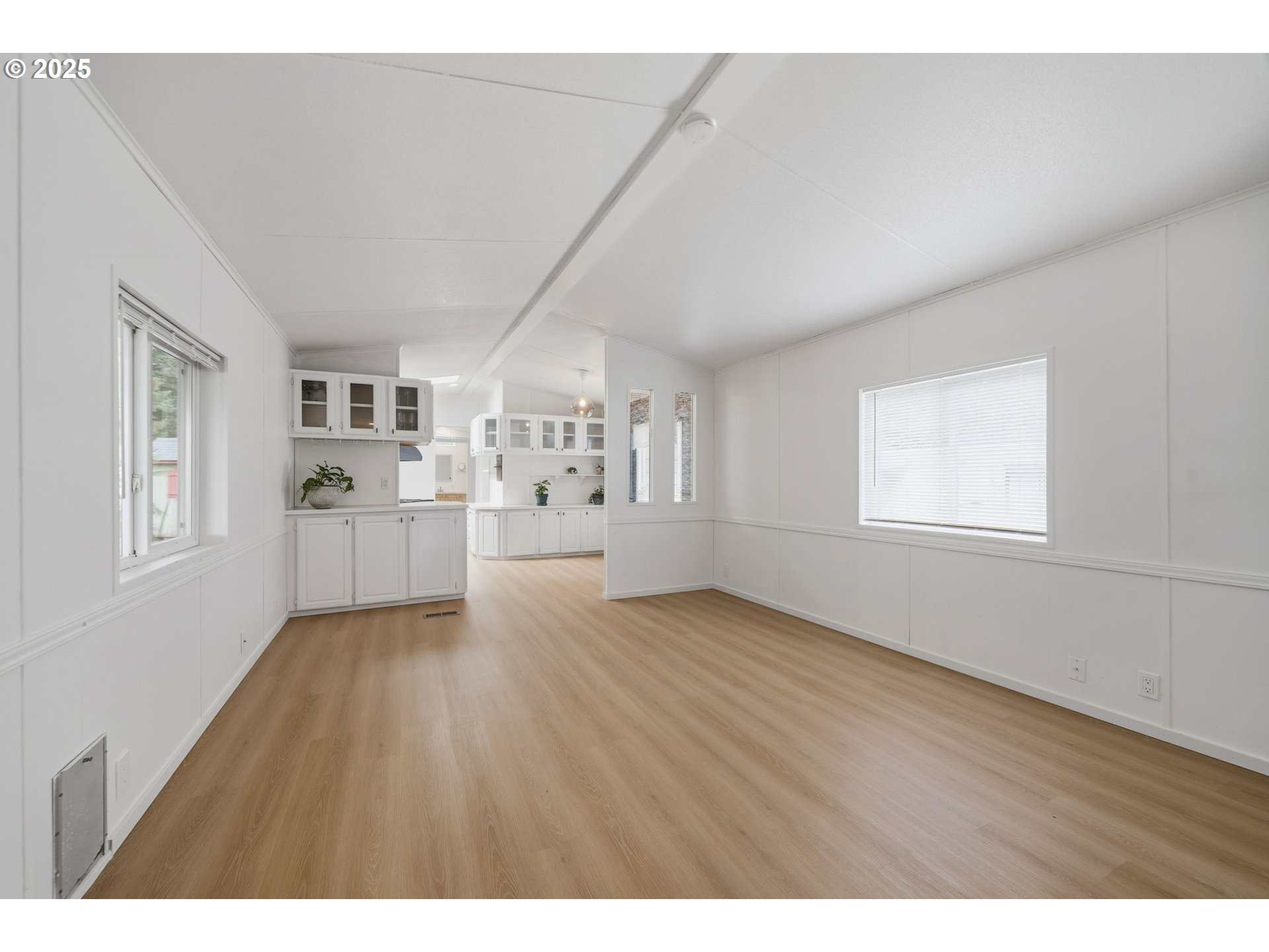 35440 Highway 211, Unit 12 Boring, OR 97009 - Photo 13 of 27 a view of a big room with wooden floor and windows