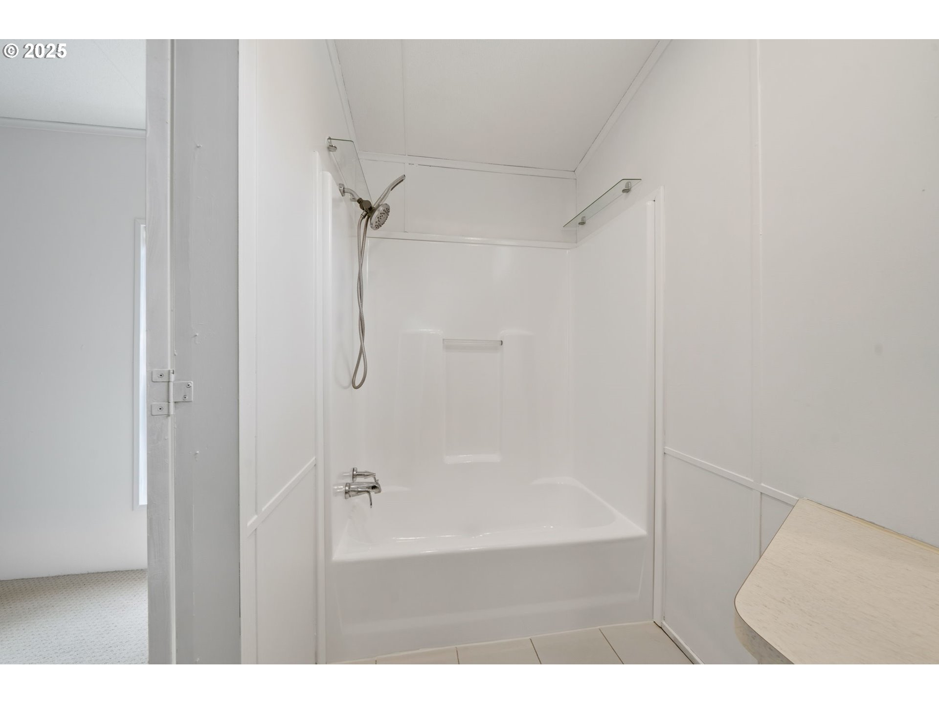 35440 Highway 211, Unit 12 Boring, OR 97009 - Photo 16 of 27 a bathroom with a glass shower door