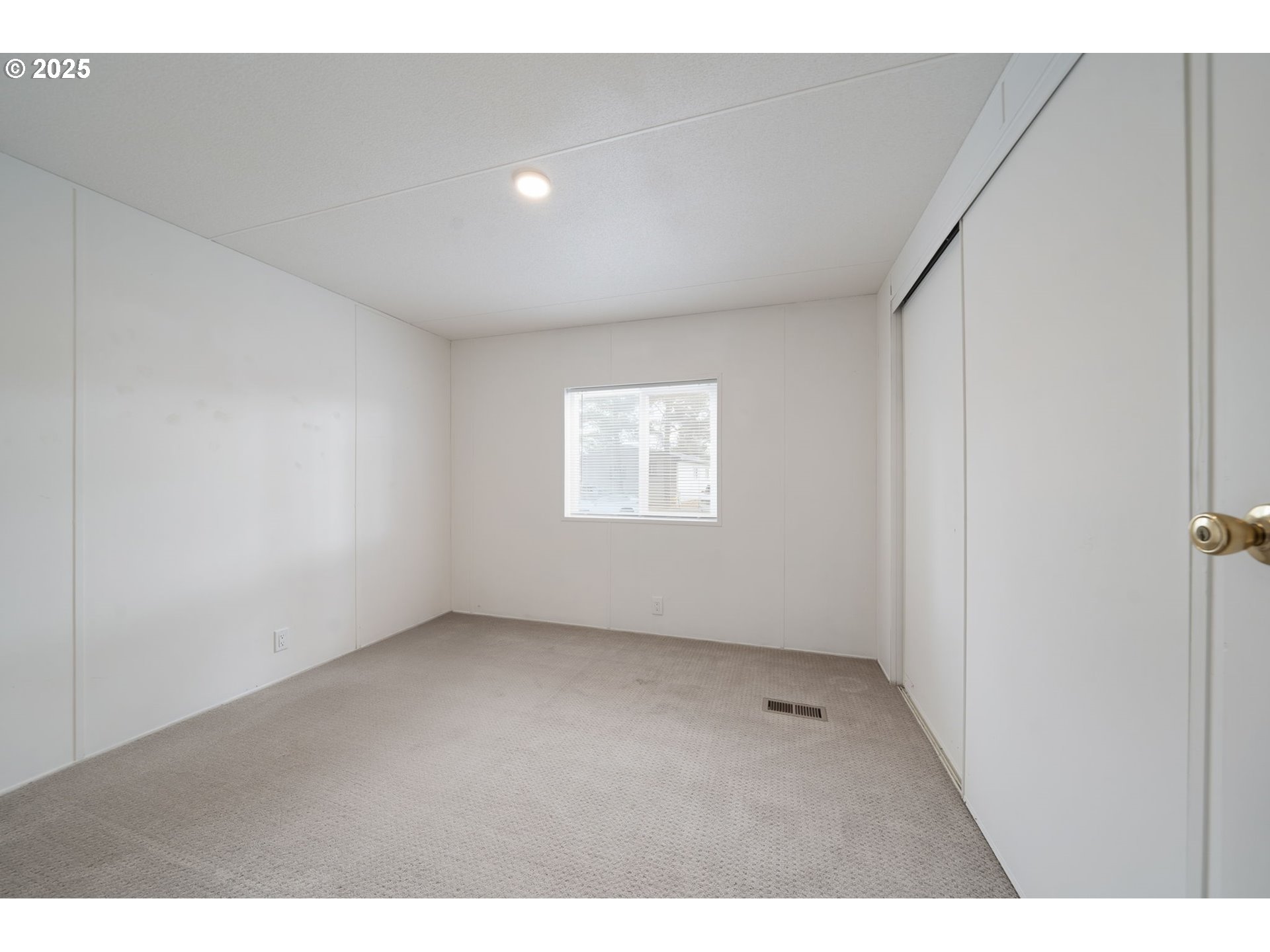 35440 Highway 211, Unit 12 Boring, OR 97009 - Photo 18 of 27 a view of an empty room with a window