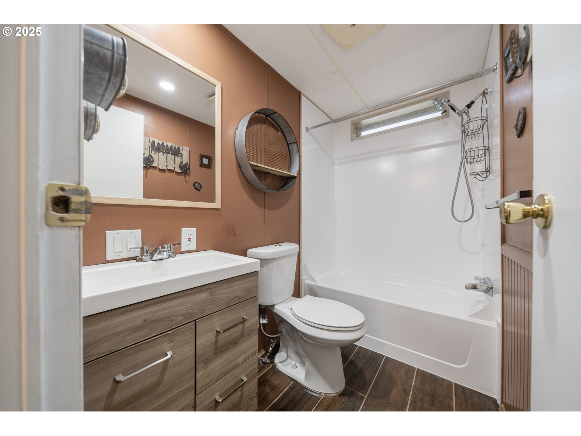 35440 Highway 211, Unit 12 Boring, OR 97009 - Photo 20 of 27 a bathroom with a sink a toilet a mirror and shower