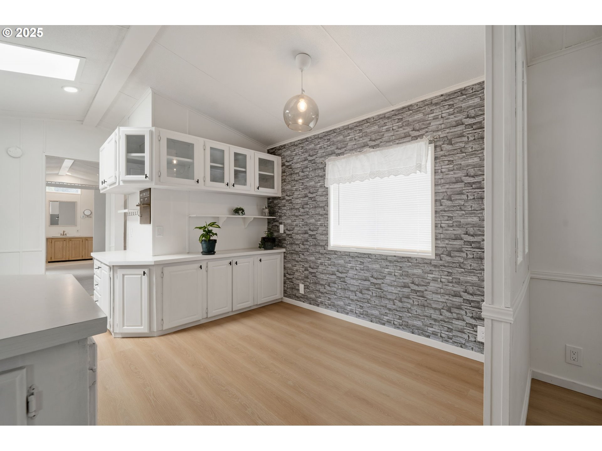 35440 Highway 211, Unit 12 Boring, OR 97009 - Photo 5 of 27 a hallway with cabinets and window