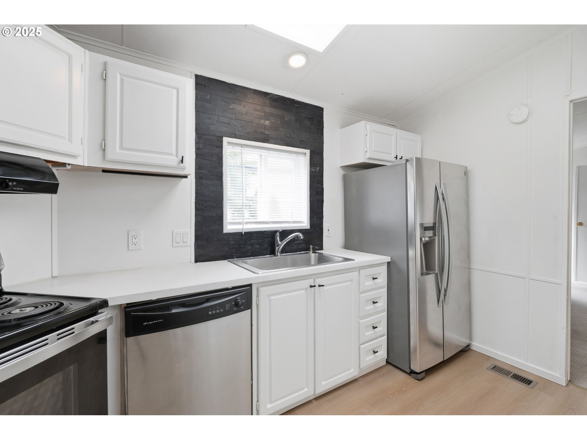 35440 Highway 211, Unit 12 Boring, OR 97009 - Photo 7 of 27 a kitchen with stainless steel appliances a sink stove and refrigerator