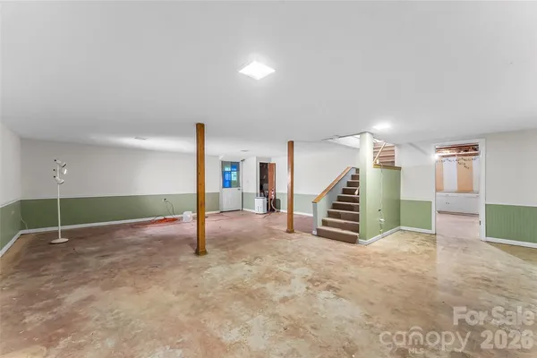 a view of an empty room with stairs