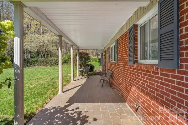 a view of a porch with wooden floor and outdoor space