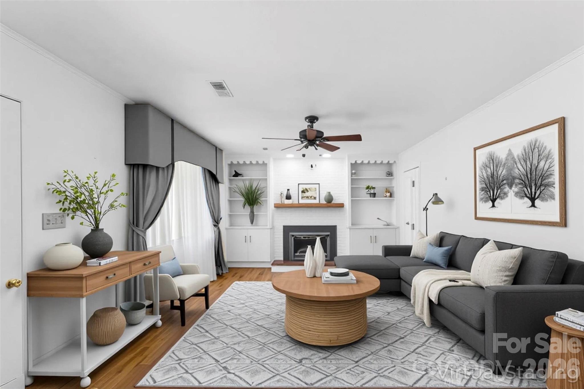 512 Paxton Creek Road Marion, NC 28752 - Photo 7 of 34 a living room with furniture a fireplace and a chandelier