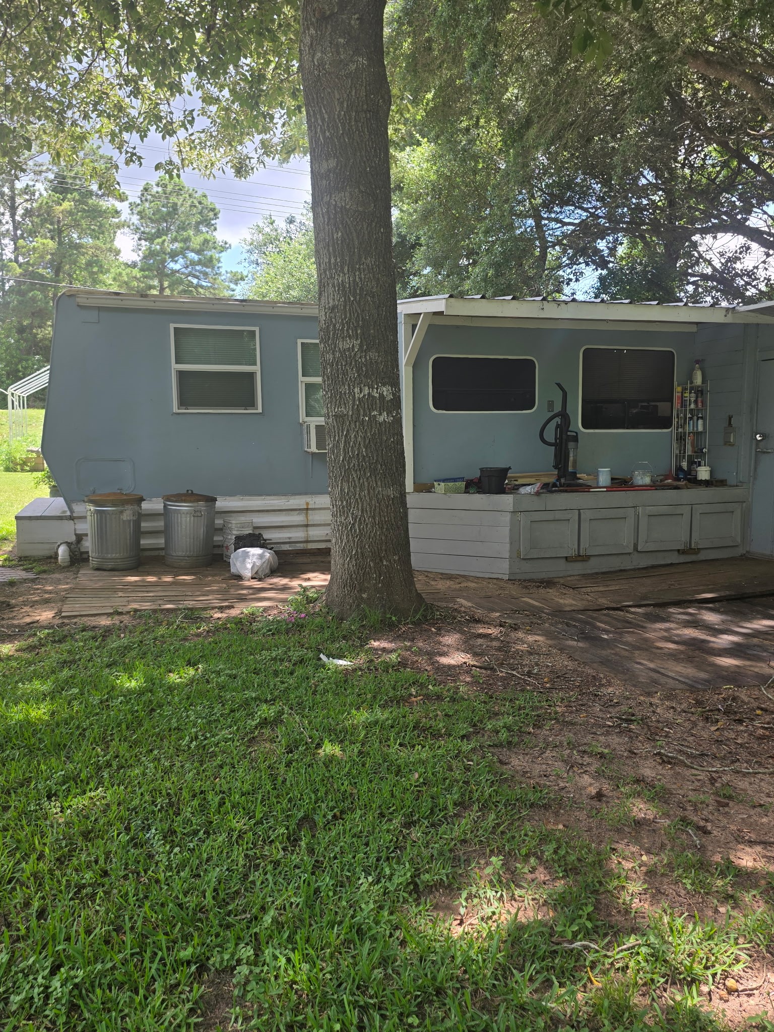 11 Pine Road Coldspring, TX 77331 - Photo 7 of 32 a view of a house with backyard and sitting area