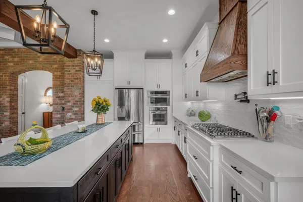 a kitchen with cabinets and stainless steel appliances