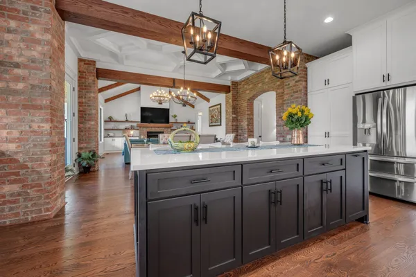 an aerial view of a house with swimming pool garden and patio