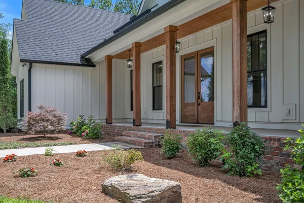 a view of room with window and wooden floor