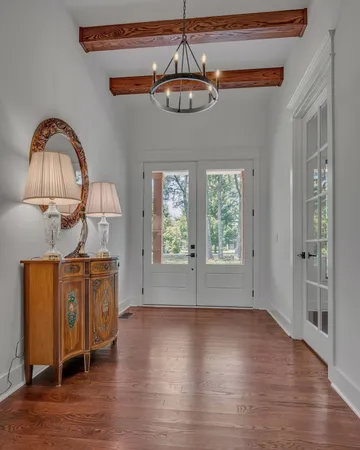 a kitchen with stainless steel appliances granite countertop a refrigerator and a stove