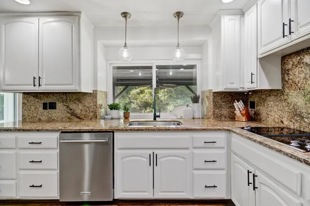 a bathroom with a sink vanity and a mirror