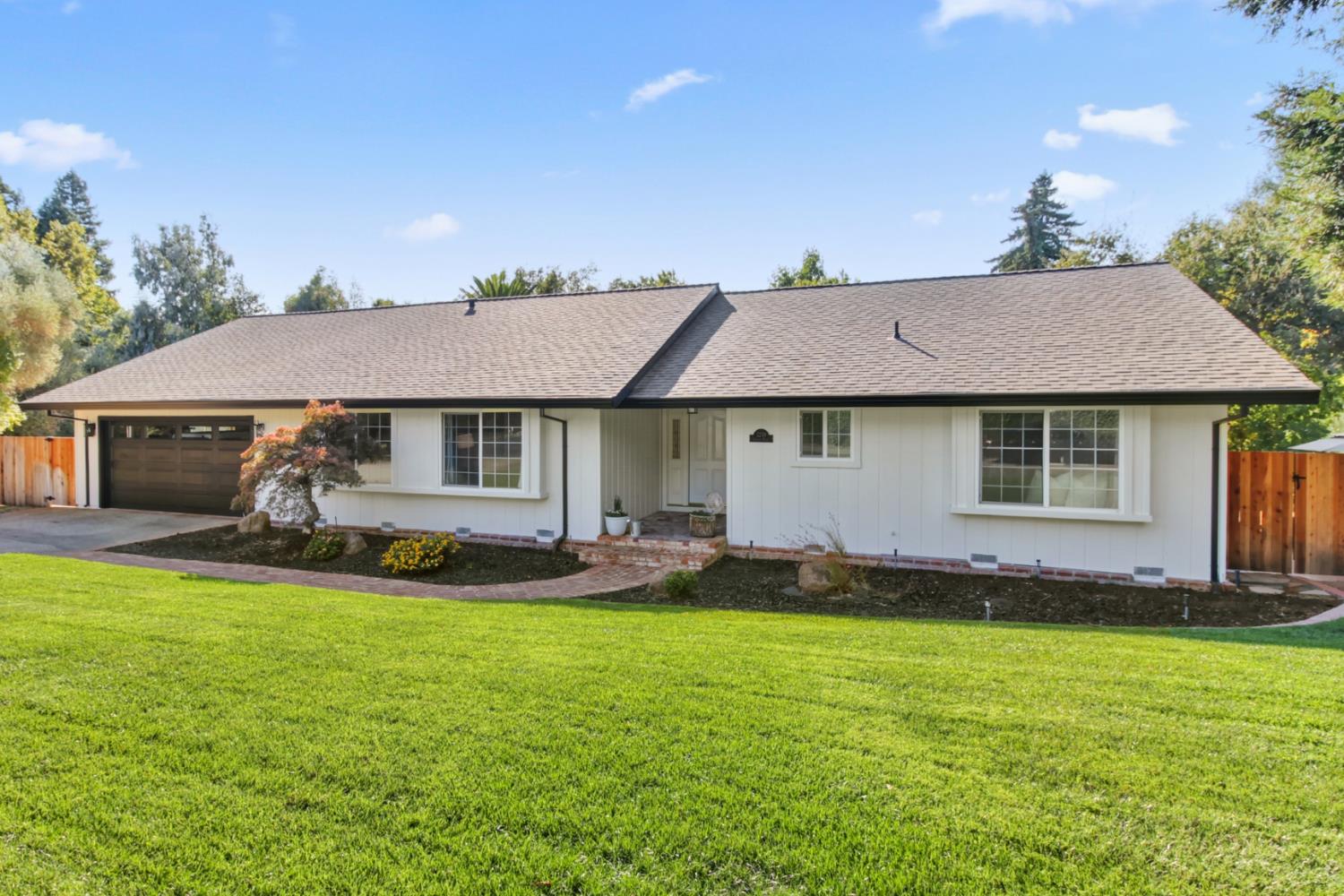 2239 Seabler Place Carmichael, CA 95608 - Photo 4 of 68 a front view of a house with a garden and yard