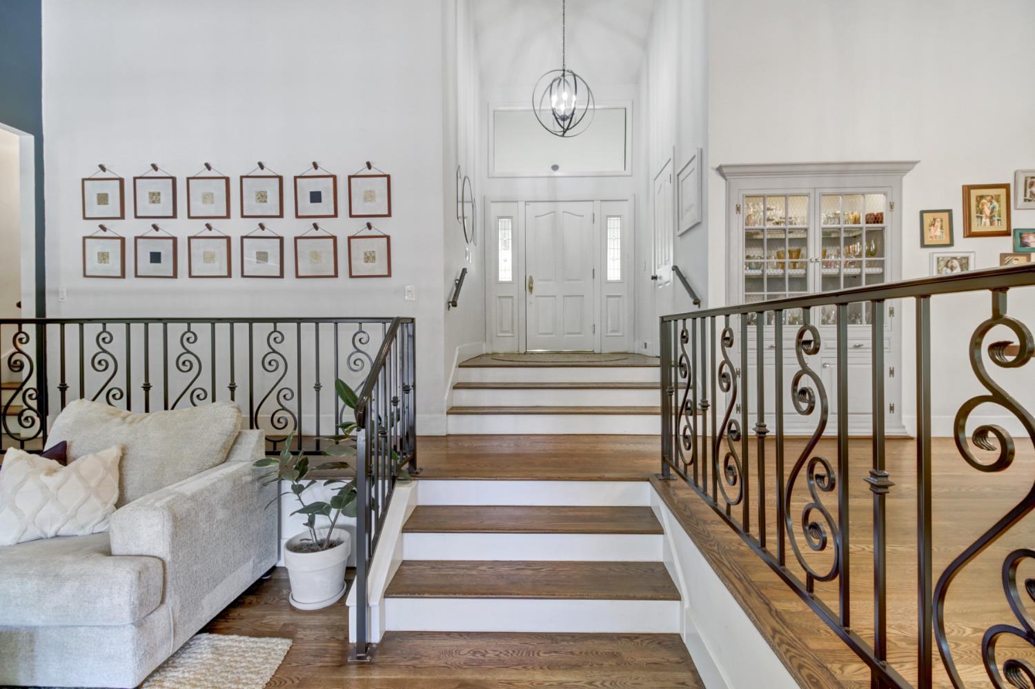 2239 Seabler Place Carmichael, CA 95608 - Photo 6 of 68 a view of staircase with lots of frames on wall and a window