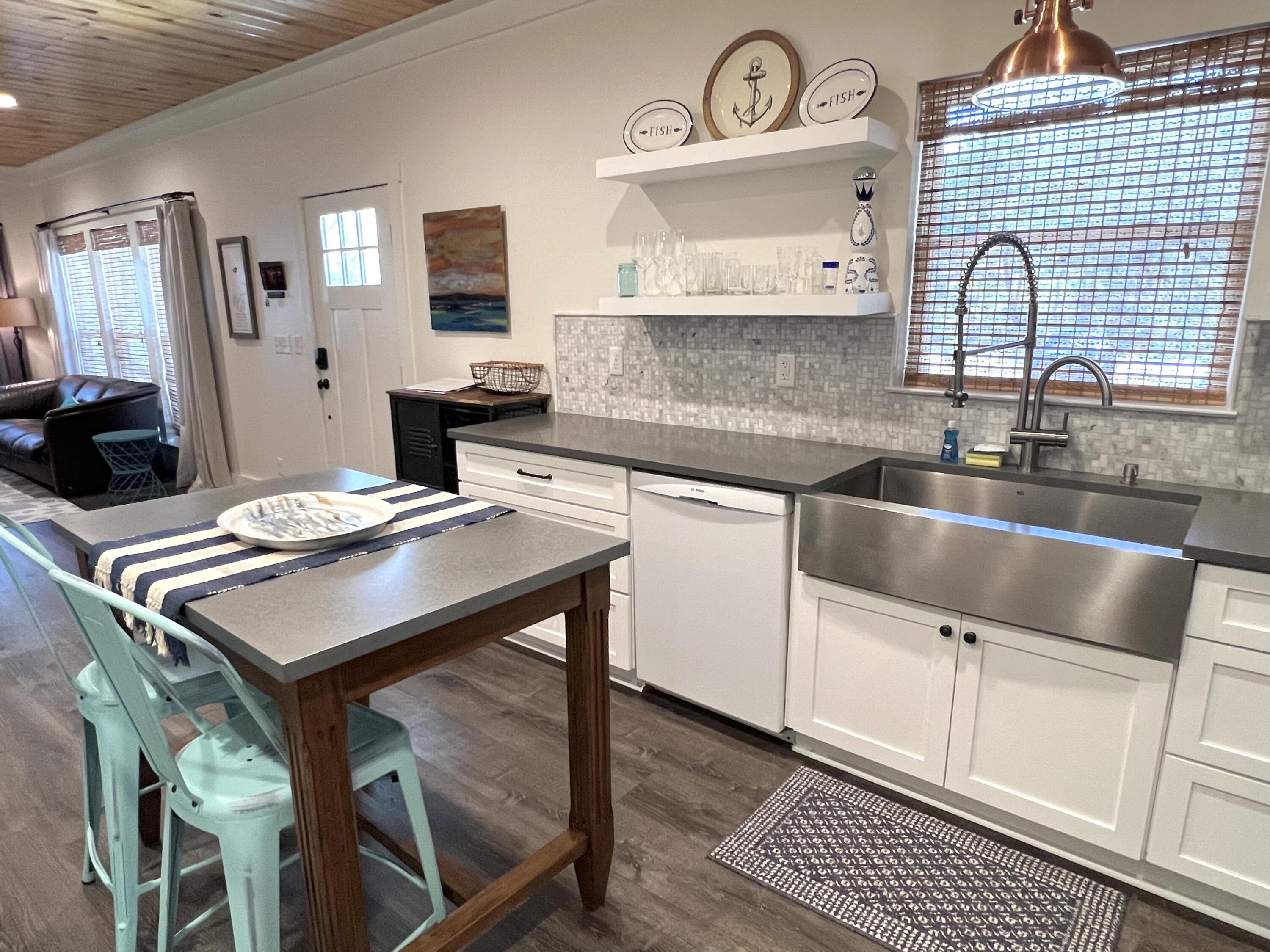 305 Pinewood Lane Inlet Beach, FL 32461 - Photo 13 of 28 a kitchen with a sink cabinets and wooden floor