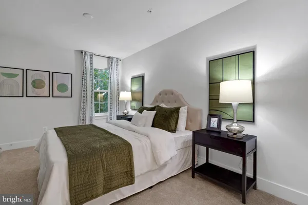 a bedroom with a bed and a mirror