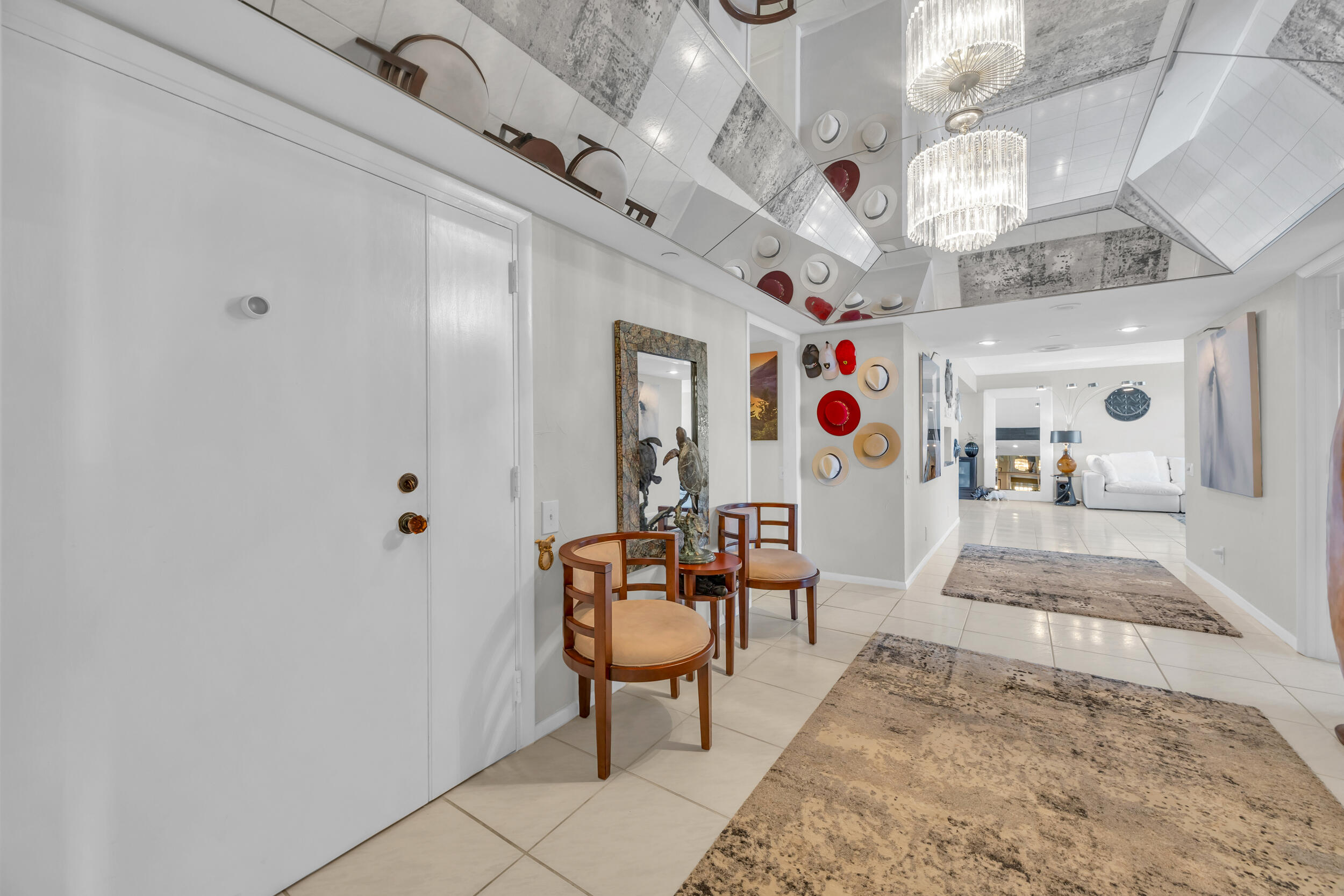 19900 South Beach Road, Unit 503 Jupiter, FL 33469 - Photo 16 of 51 a view of a hallway with dining room and chandelier