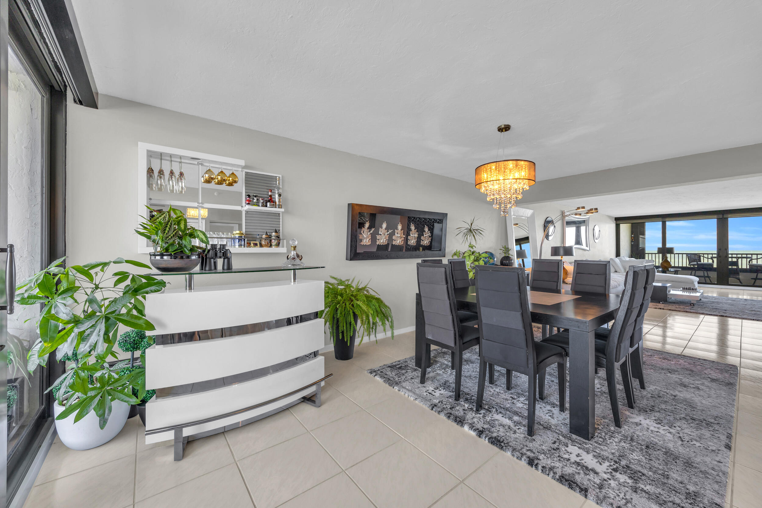 19900 South Beach Road, Unit 503 Jupiter, FL 33469 - Photo 22 of 51 a view of a dining room with furniture and chandelier
