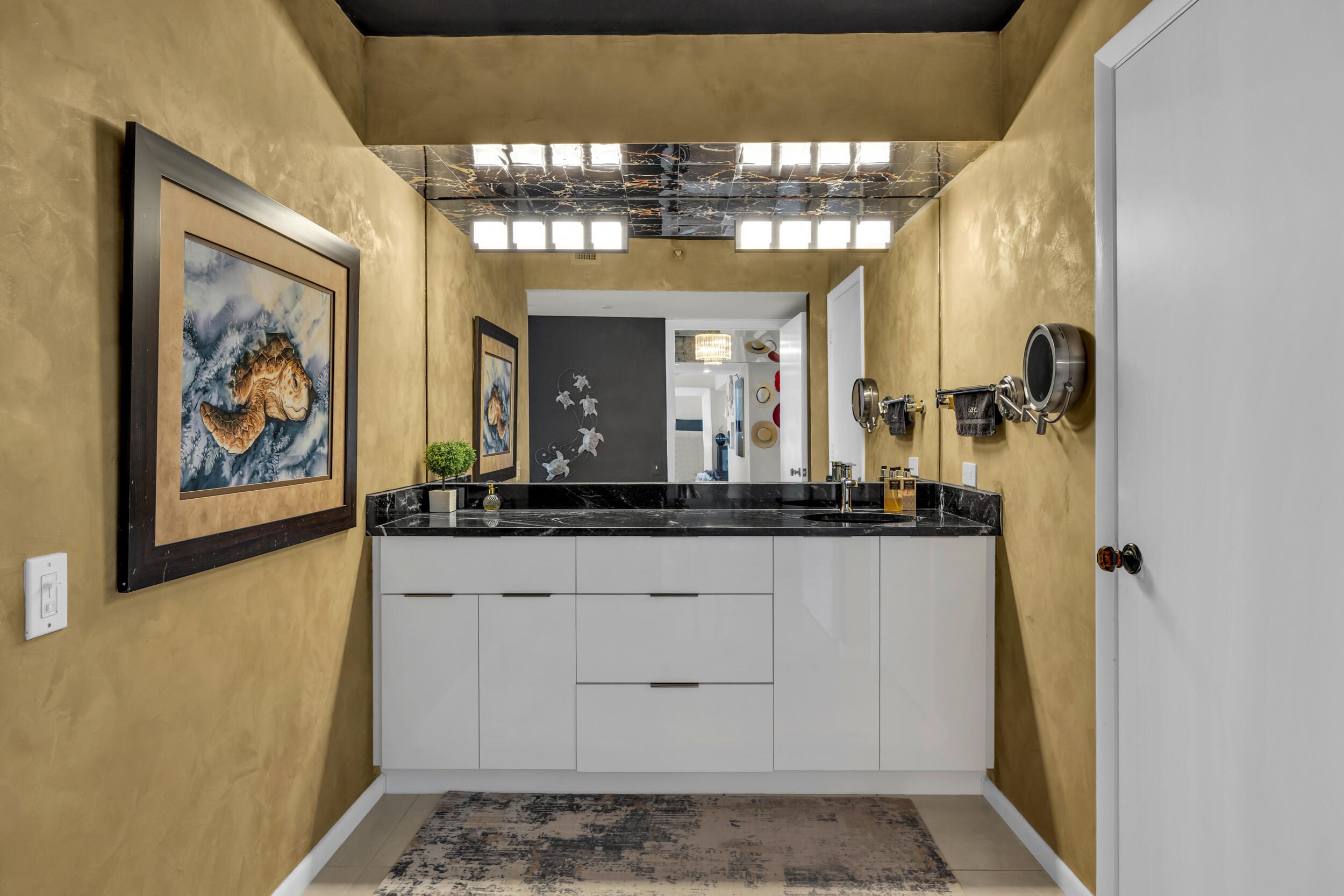 19900 South Beach Road, Unit 503 Jupiter, FL 33469 - Photo 37 of 51 a bathroom with a sink and a mirror