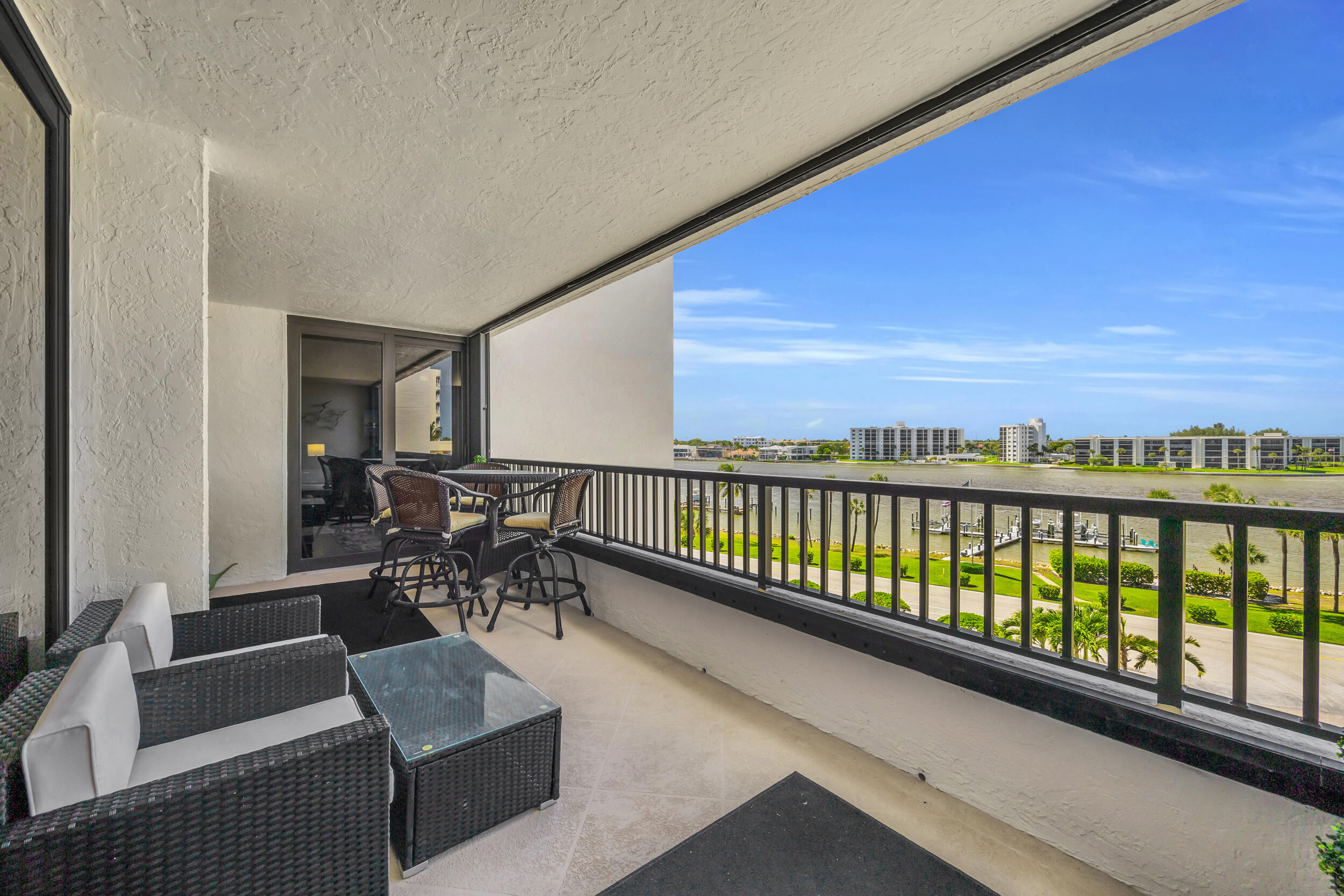 19900 South Beach Road, Unit 503 Jupiter, FL 33469 - Photo 10 of 51 a view of a chairs and table in patio