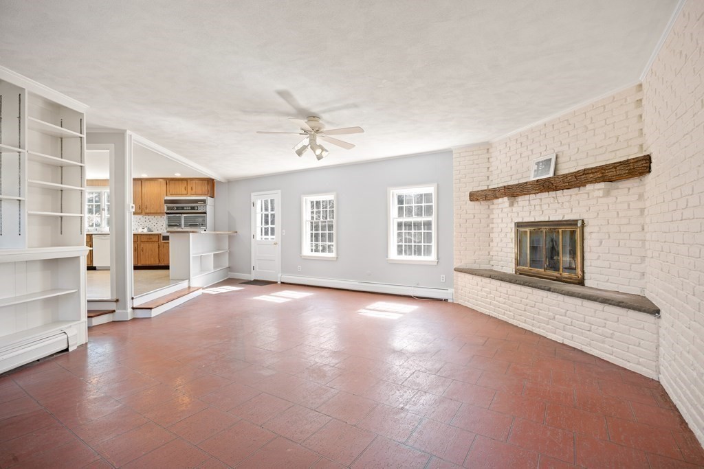 8 Juniper Place Lexington, MA 02420 - Photo 13 of 42 an empty room with windows and fireplace