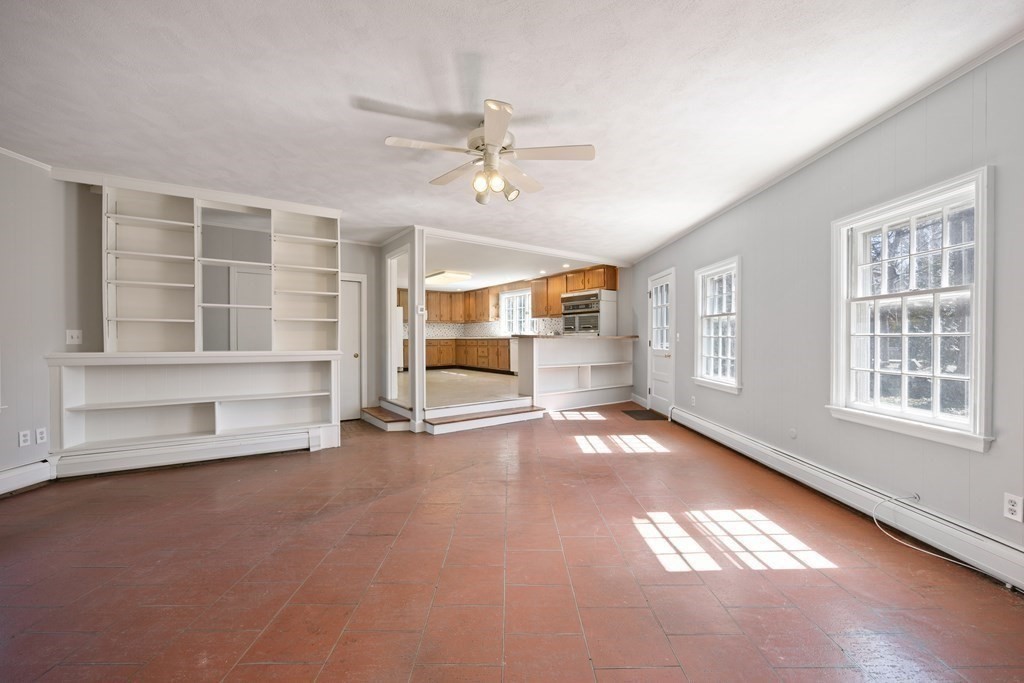 8 Juniper Place Lexington, MA 02420 - Photo 14 of 42 an empty room with windows and pillars in it