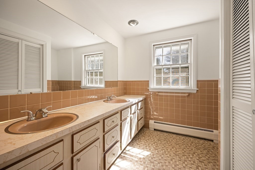 8 Juniper Place Lexington, MA 02420 - Photo 15 of 42 a bathroom with a sink and a tub