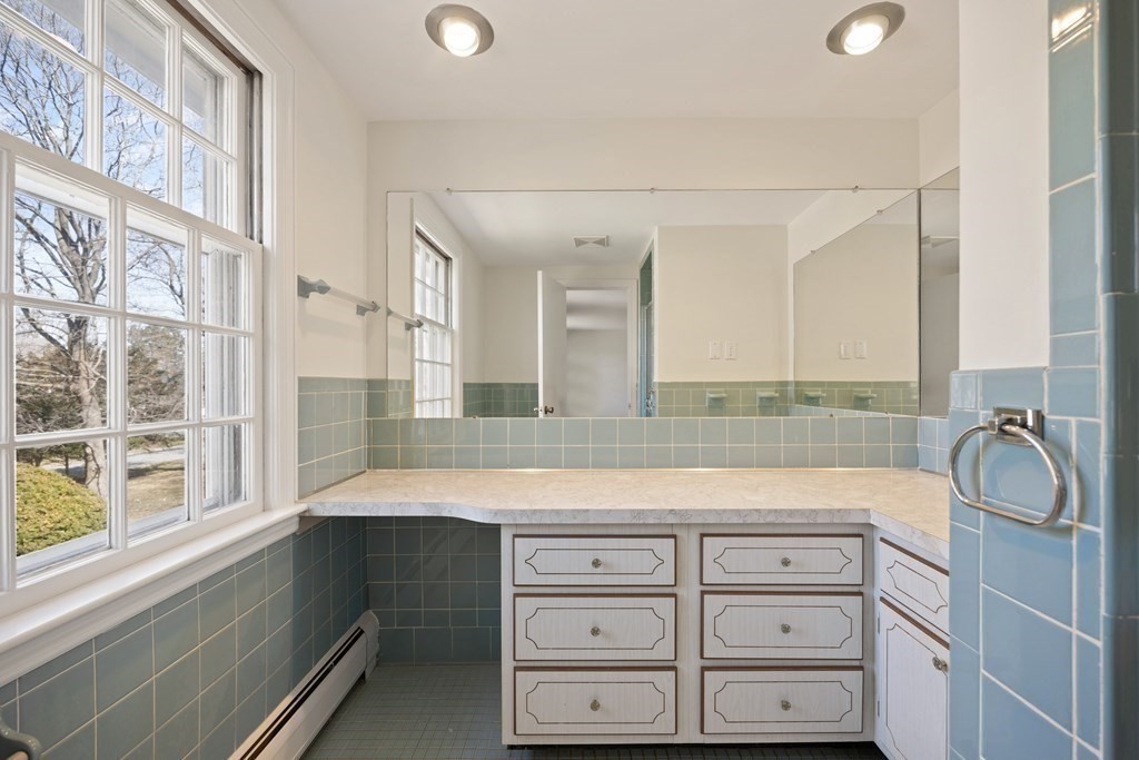 8 Juniper Place Lexington, MA 02420 - Photo 22 of 42 a bathroom with a tub sink and mirror