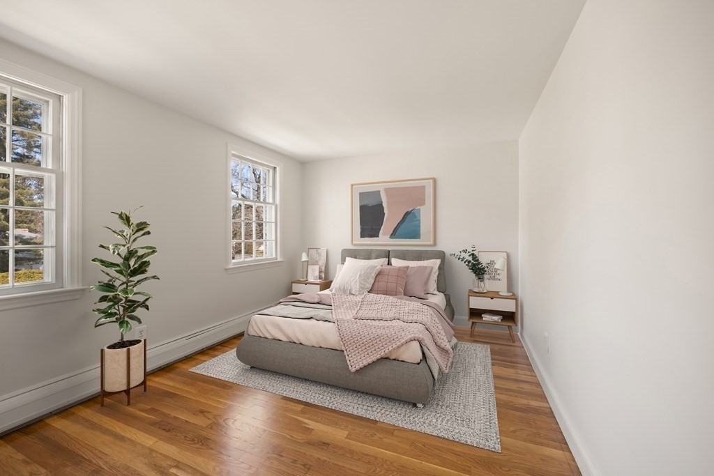 8 Juniper Place Lexington, MA 02420 - Photo 23 of 42 a bedroom with a bed and a potted plant