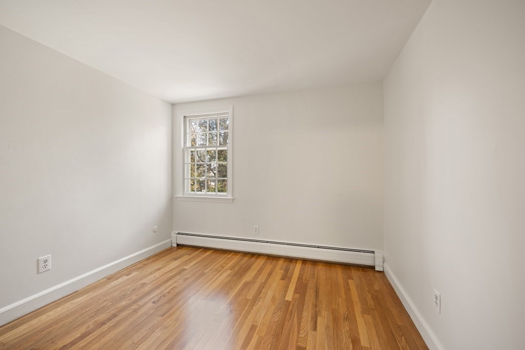 8 Juniper Place Lexington, MA 02420 - Photo 28 of 42 a view of a room with wooden floor and natural light