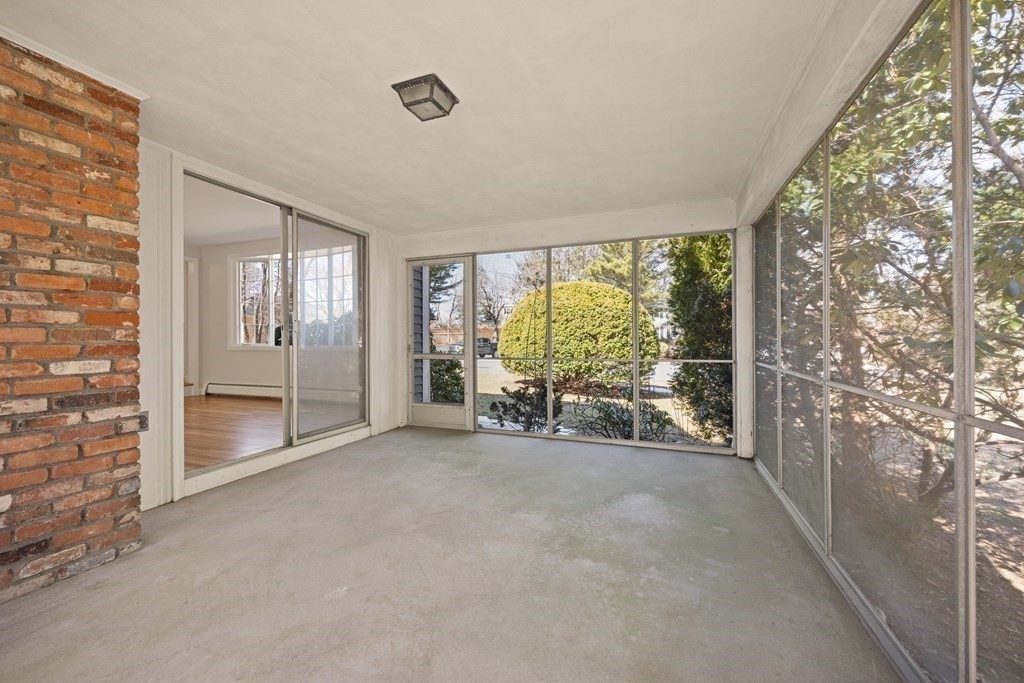 8 Juniper Place Lexington, MA 02420 - Photo 33 of 42 a view of an empty room with large windows