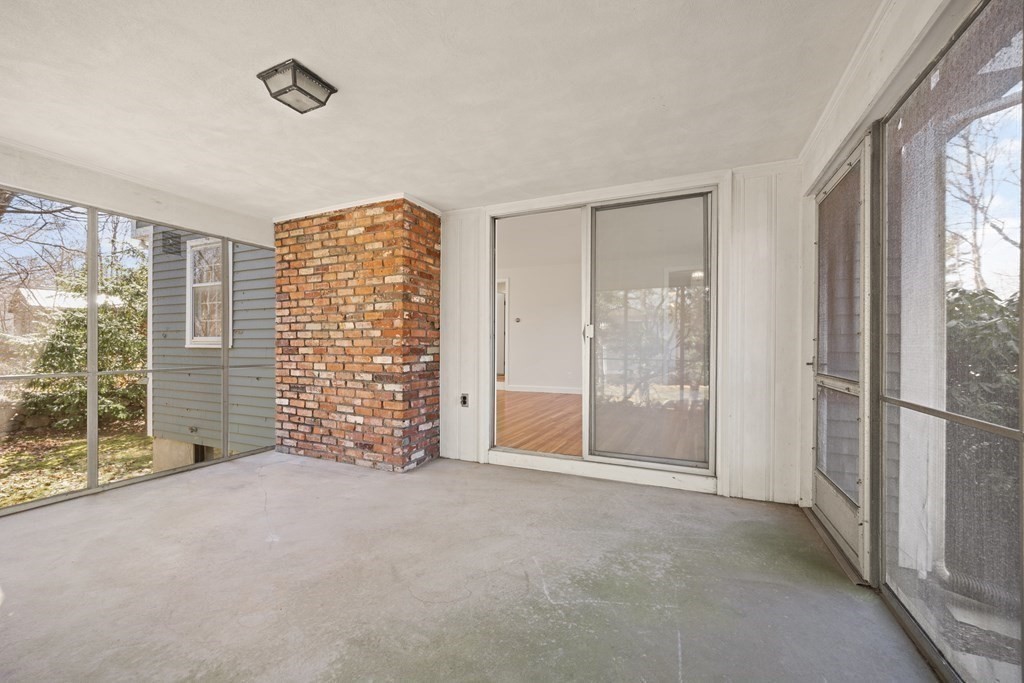 8 Juniper Place Lexington, MA 02420 - Photo 34 of 42 a view of an empty room with a balcony