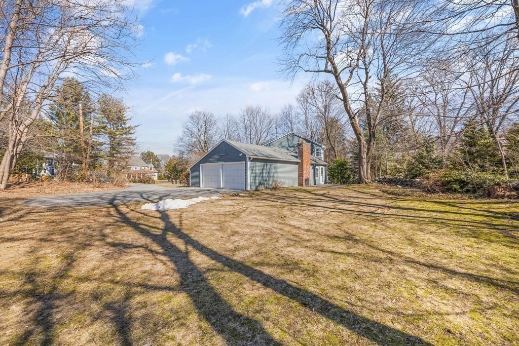 8 Juniper Place Lexington, MA 02420 - Photo 38 of 42 a backyard of house with large trees