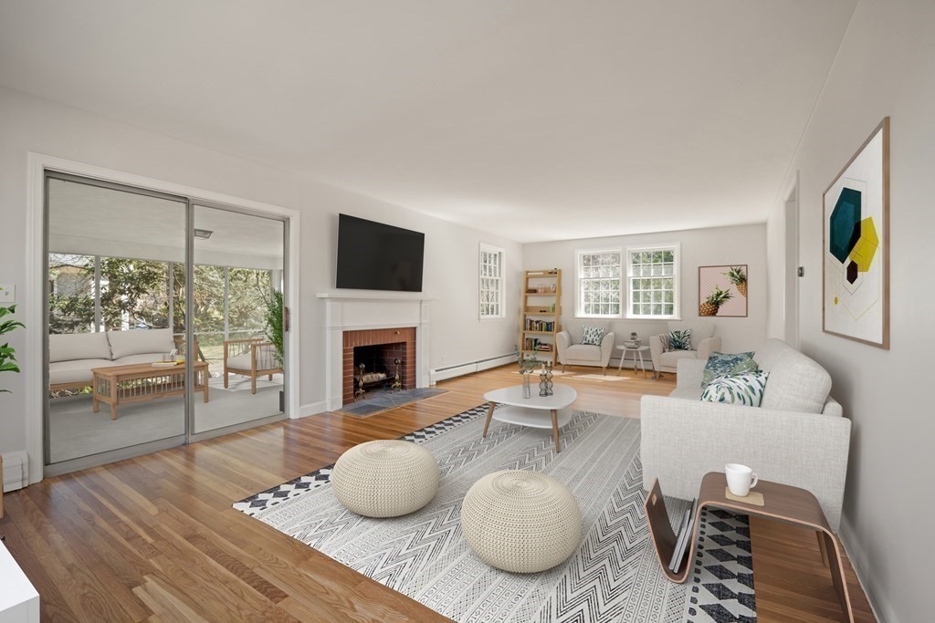 8 Juniper Place Lexington, MA 02420 - Photo 4 of 42 a living room with furniture a fireplace and a flat screen tv