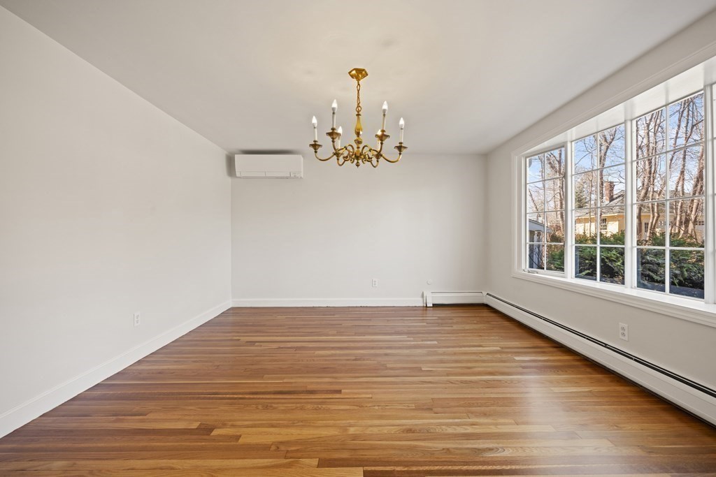 8 Juniper Place Lexington, MA 02420 - Photo 10 of 42 wooden floor in an empty room with a window