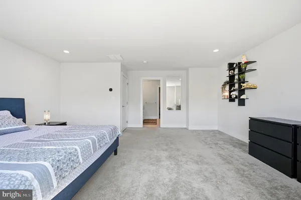 a bedroom with a bed and cabinets