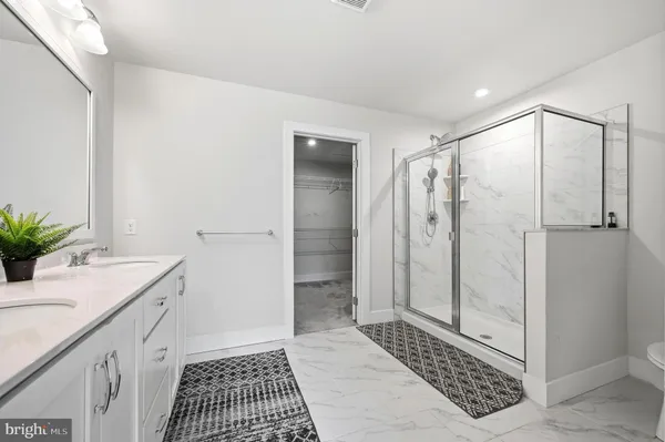 a bathroom with a shower and a sink