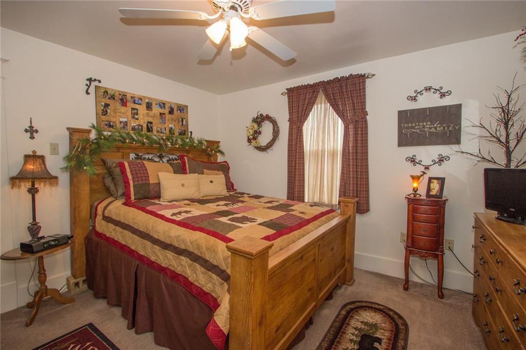307 Darlington Road Beaver Falls, PA 15010 - Photo 13 of 21 Master Bedroom features wide trim, wall-wall carpeting in neutral tone, a ceiling fan and plenty of light!